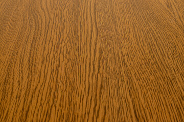 焦げ茶色の木板の表面模様