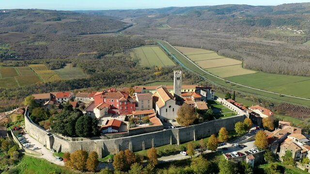 Stone Houses And Church Tower Bell At The Old Town Of Motovun In Central Istria, Croatia. Aerial Pullback