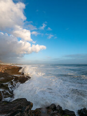 Large ocean swells crashing into rocky shoreline at Siever's Point. Hermanus. Whale Coast. Overberg. Western Cape. South Africa