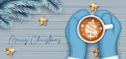 Hands in knitted mittens holding a cup of coffee. Christmas greeting card template