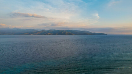 Aerial view of Gili Trawangan Island, Indonesia with morning sunrise sunlight. Lombok, Indonesia