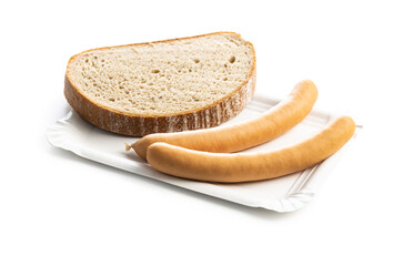 Smoked frankfurter sausages with bread on paper plate