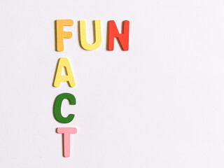 Word fun fact made of wooden alphabet against white background.