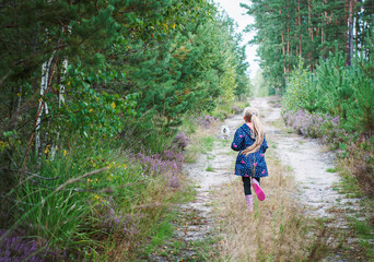 Little girl in an autumn forest