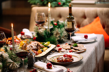 New Year festive served table with decorations and meal