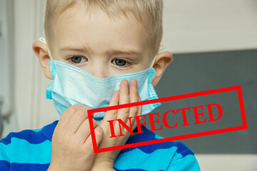 Defocused image of Young ill boy at the hospital in mask. Image with inscription INFECTED.  Sick...