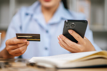 Young woman use credit card payment shopping online