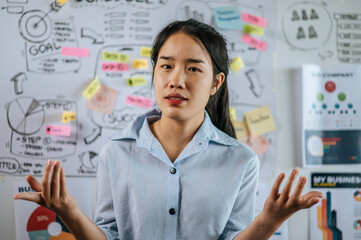 Young working woman present planing of project on board