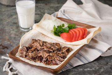 Turkish doner kebab on the lavash bread