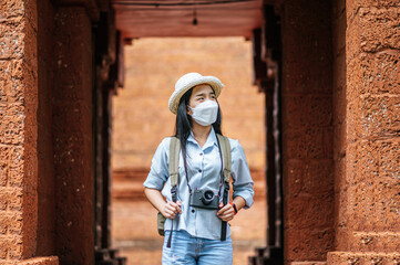 Young backpacker female travel in historic site