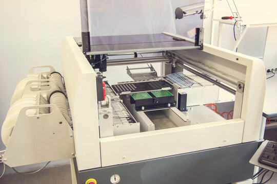 Factory for the electronic production. Technological process of soldering and assembly chip components on pcb board. Automated soldering machine