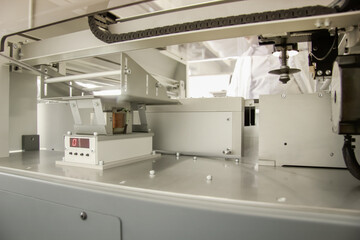 Factory for the electronic production. Technological process of soldering and assembly chip components on pcb board. Automated soldering machine inside