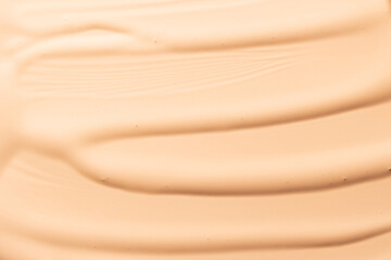 Obraz premium Makeup foundation background. Liquid foundation, concealer brush strokes and face powder. Makeup base, BB, CC cream texture