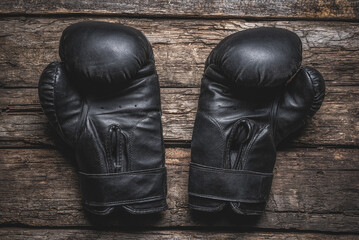 old black boxing gloves flat lay background.