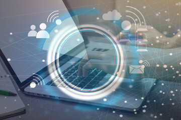 Connect to wi-fi concept. man holding smartphone with wi-fi connection on the screen with laptop background