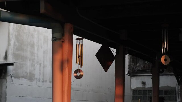 Handmade bells made using CD, the CD dis is moving and reflecting the sun. High quality 4k footage