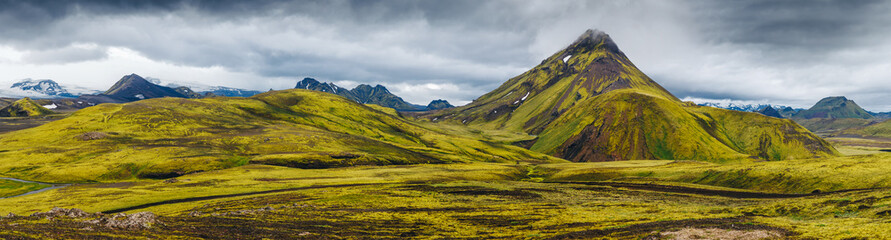 Fototapeta premium Beautiful Icelandic landscape with mountains, sky and clouds. Trekking in national park Landmannalaugar