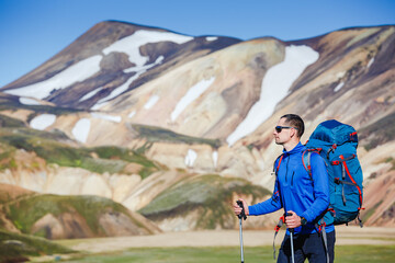 hiker with backpack enjoying the landscape of Iceland while hiking the Laugavegur trail