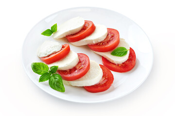 Caprese salad with fresh tomatoes, mozzarella cheese and basilic isolated on white background. With clipping path.