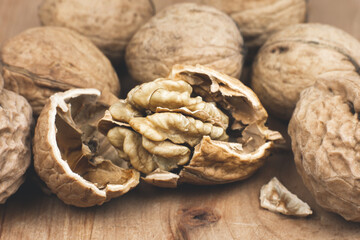 Crushed Walnut on the wood background. Close up.