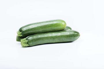 Green zucchinis isolated on white background