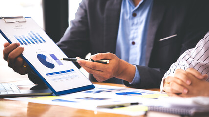 Team work with business analytic price chart on the table at the conference room.