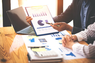 Team work with business analytic price chart on the table at the conference room.