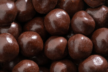 Detailed and large close up shot of chocolate covered fruits.