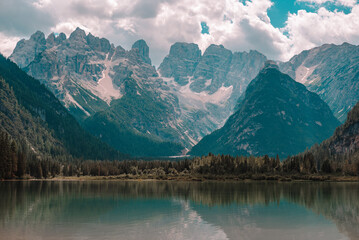 Lake and a Dolomites mountain top in background, South Tyrol, Italy.