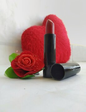 Beautiful red lipstick in a white background. 