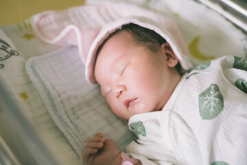 Newborn baby in the sun