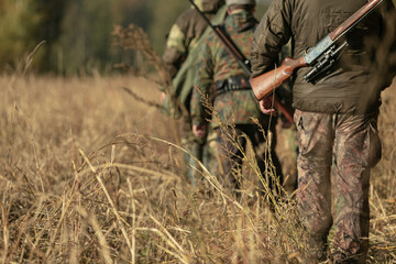 Group of hunters during hunting in the forest - 464203217