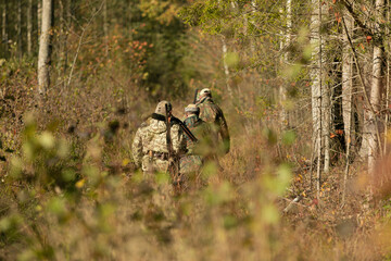 Group of hunters during hunting in the forest