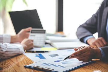 Team work with business analytic price chart on the table at the conference room.