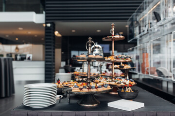 Catering services with snacks and glasses of wine on bartender counter in the restaurant