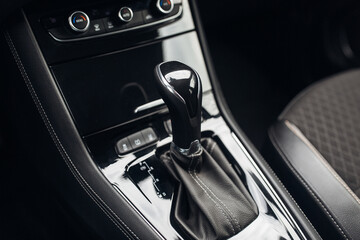 Fototapeta na wymiar Modern car gearbox handle stick close up