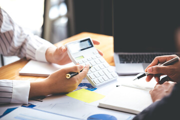 Team work with business analytic price chart on the table at the conference room.