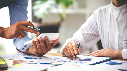Team work with business analytic price chart on the table at the conference room.
