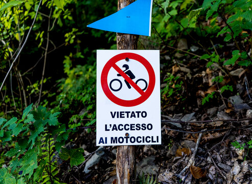 Sign meaning "No access to motocycle" in the wood of Montieri, province of Grosseto, Tuscany region, Italy.