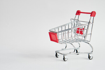 empty trolley on light background shopping supermarket service