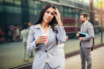 Fototapeta premium Stressed business woman in the city.