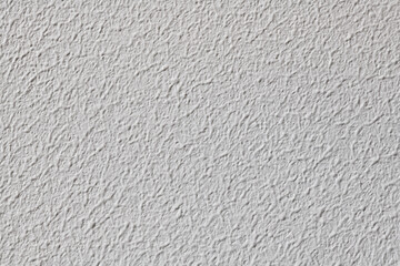 White wall with embossed paint pattern. 