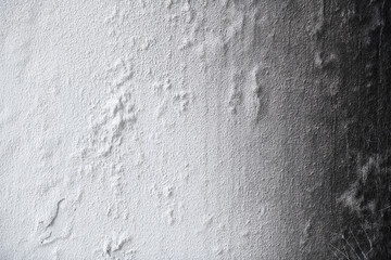 Burned wall texture. Burned wall background. Detail of a wall destroyed by fire. Abstract background and texture for designers. Close up view of burned wall. 