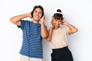 Young mixed race friends isolated on white background listening music