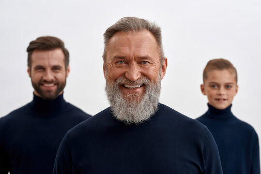 Portrait of happy mature grandfather with son and grandson