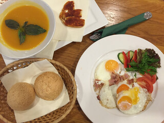 Breakfast meal with fried eggs and vegetable
