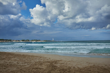 the lighthouse of San vito lo Capo in autumn with sky, clouds and wind