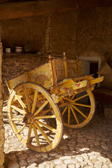 Plakat rural location with tools, carts and utensils typical of Sicilian peasant life