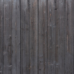 dark brown background of vertical wooden old grungy painted planks