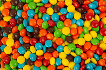 Fototapeta na wymiar Close Up Of A Pile Of Colorful Chocolate Coated Candy Background